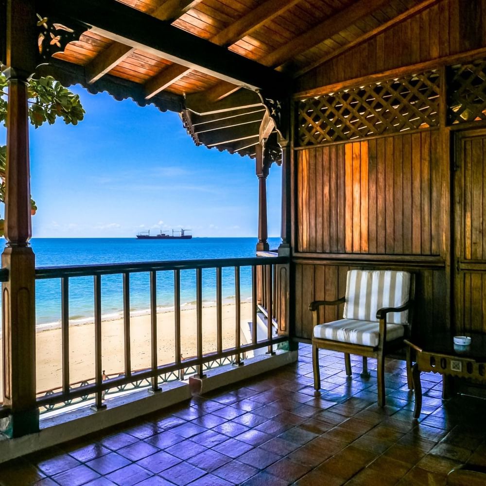 Balcony view of the beach and ocean with a ship at Zanzibar Serena Hotel.
