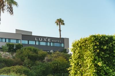 View of hotel buildings at Luxe Sunset Boulevard Hotel