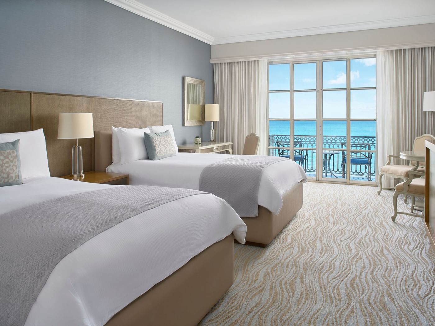 Two beds & sitting area in Club Seafront Double Room with balcony at Kempinski Hotel Cancún