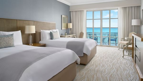 Two beds & sitting area in Club Seafront Double Room with balcony at Kempinski Hotel Cancún