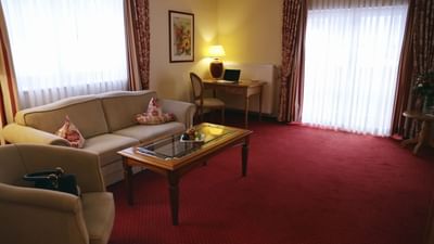 Sofa & a coffee table in Comfort Luxury Suite at Liebes Flueh