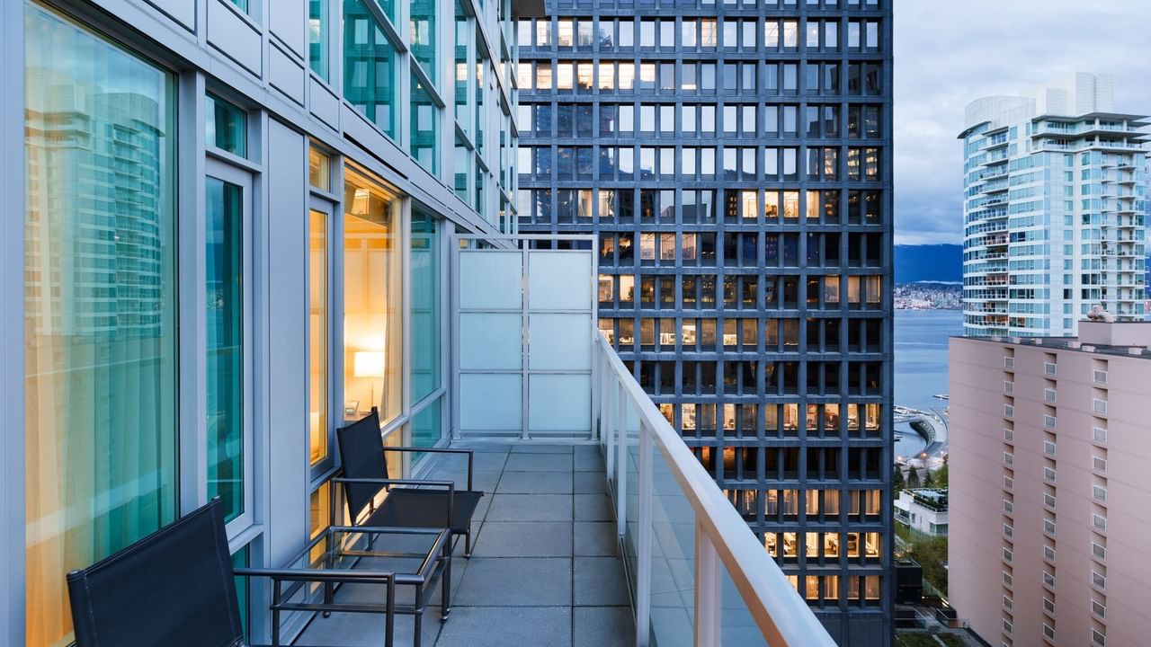 Hotel suite balcony with view of city and harbour