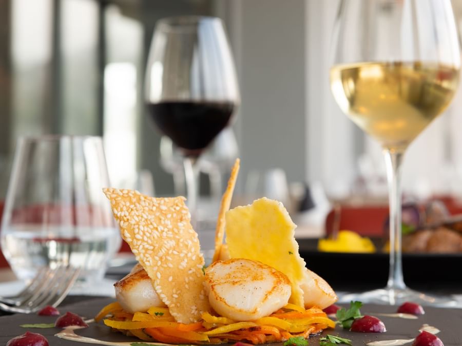 Closeup of Meals served with wine at Hotel La Villa Marine