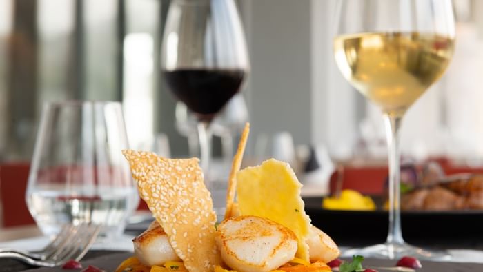 Closeup of Meals served with wine at Hotel La Villa Marine