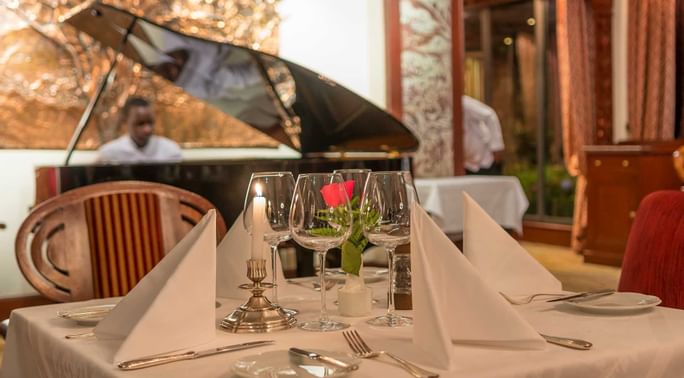 A Dinner table setup with live music at Nairobi Serena Hotel