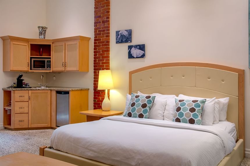 Comfy bed in King Premiere Sky at Retro Suites Hotel