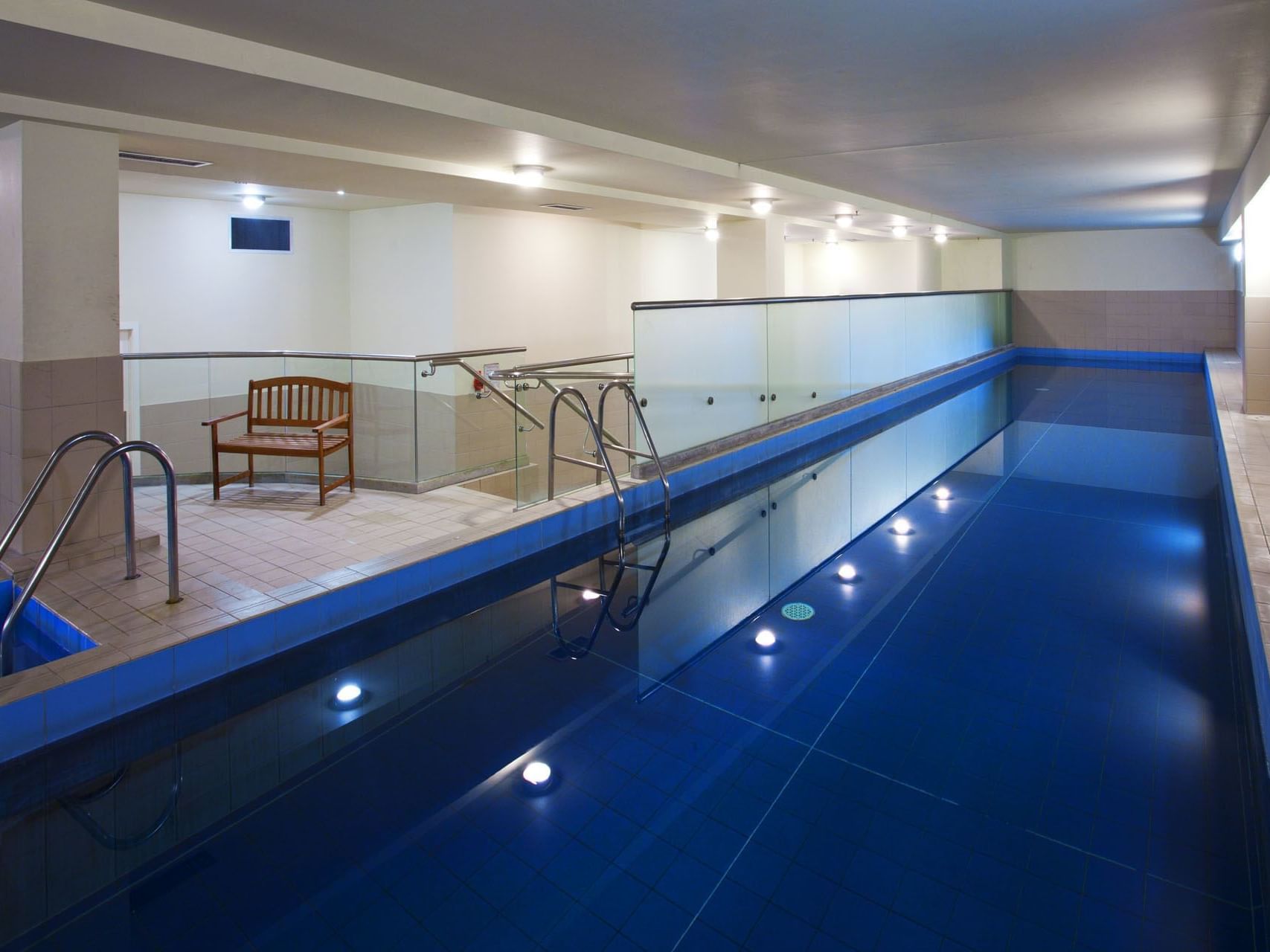 Heated indoor swimming pool area at Hotel Grand Chancellor