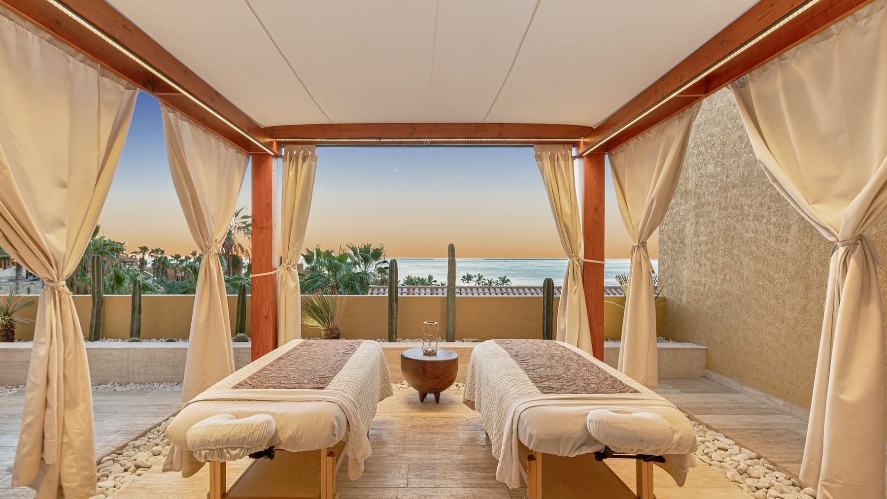 Outdoor massage cabin with spa beds & ocean view at Grand Fiesta Americana