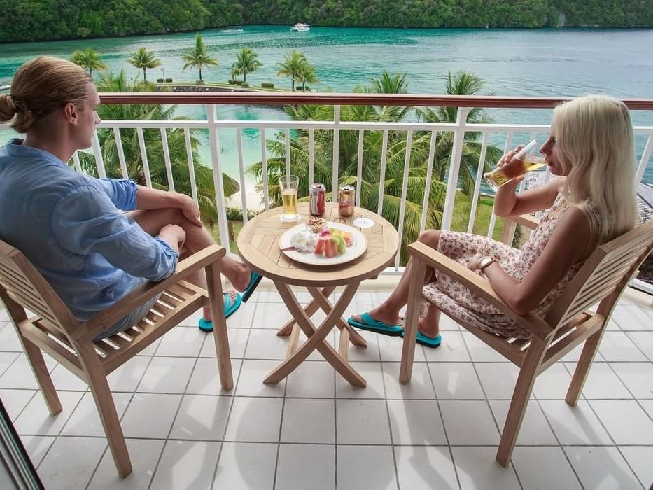 Couple dining on a balcony with sea view at Palau Royal Resort