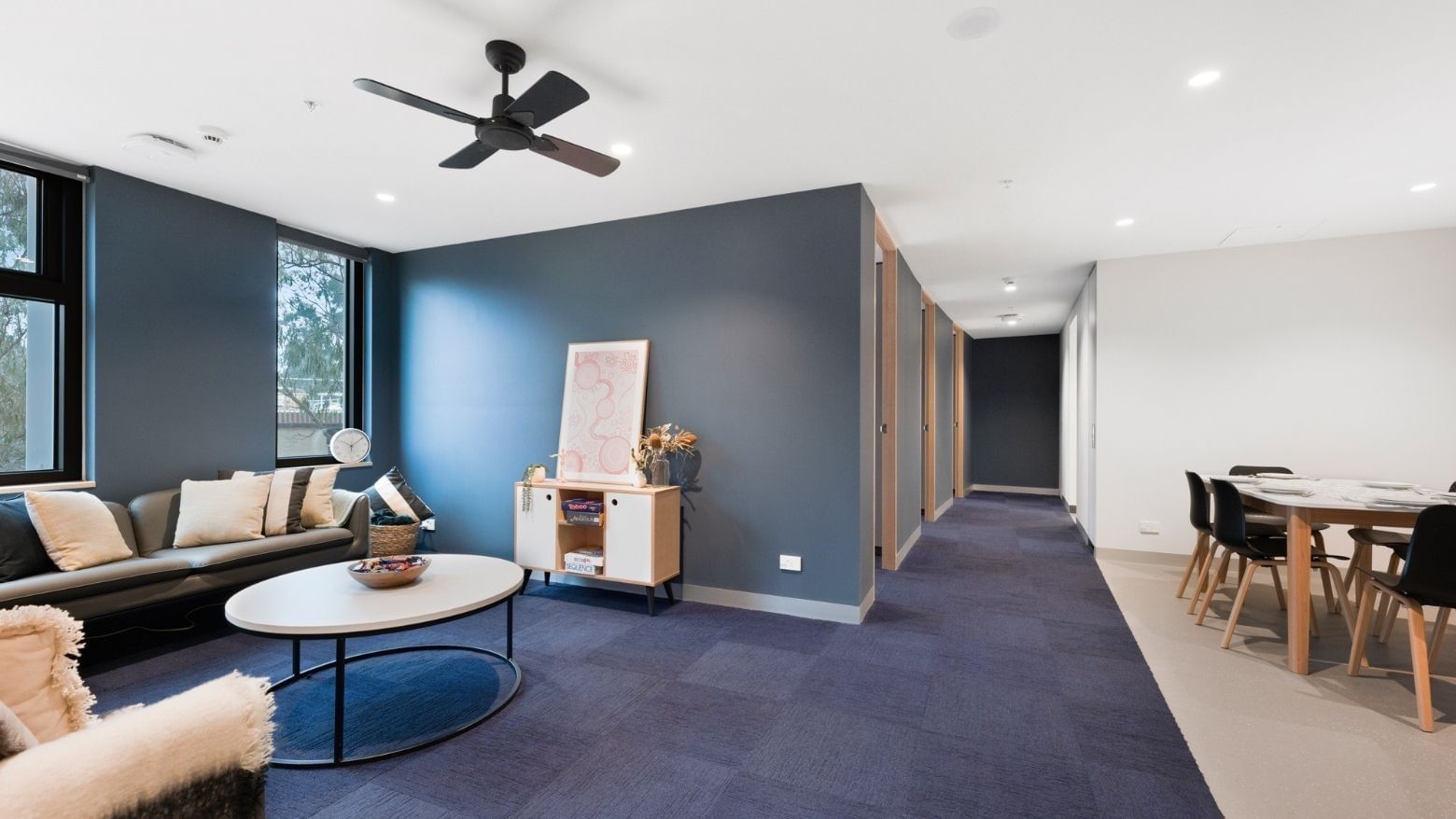 Modern interior of La Trobe University - North and South Apartments with lounge, dining area, and hallway.