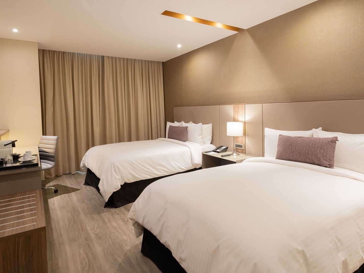2 Double Deluxe Superior Beds with two beds, and a sleek wooden desk at Camino Real Fashion Drive, Monterrey