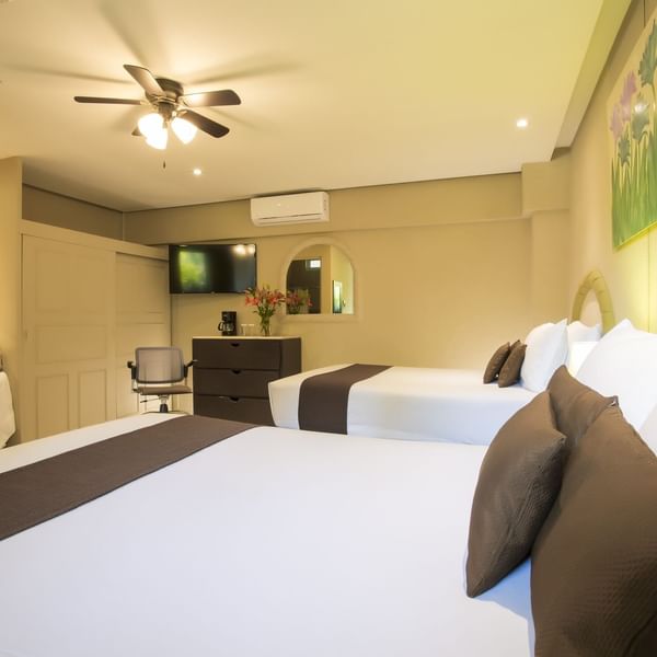 Twin comfy beds in Superior Room at Gamma Hotels