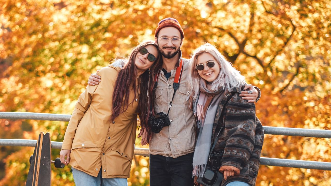 friends enjoying autumn together outdoors