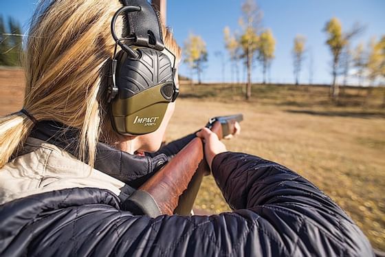 A woman shooting in a field near Hotel Jackson