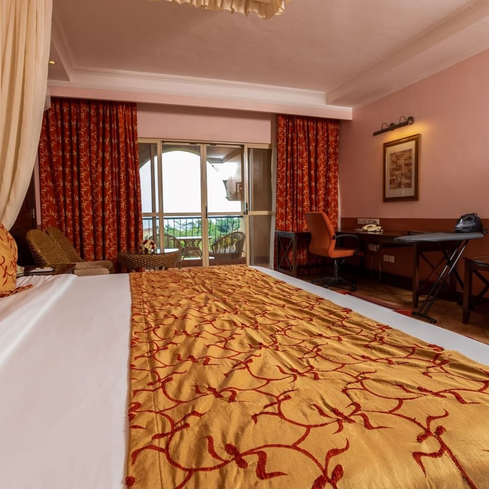 Elegant Standard Deluxe Room with balcony view at Lake Victoria Serena Golf Resort & Spa in Kampala.