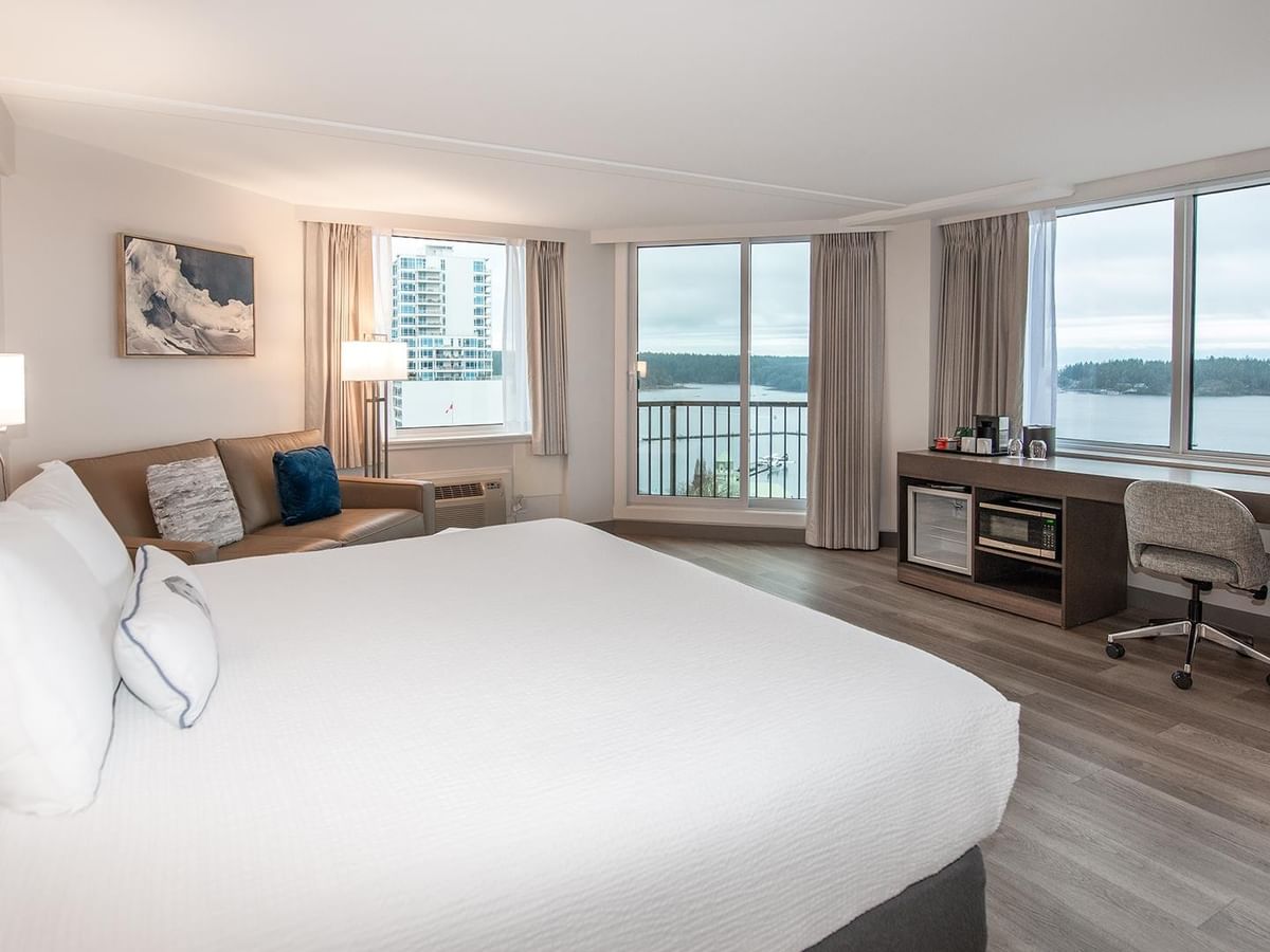 King-sized bed in Coast Premium King room with ocean view at Coast Bastion Hotel in Nanaimo.