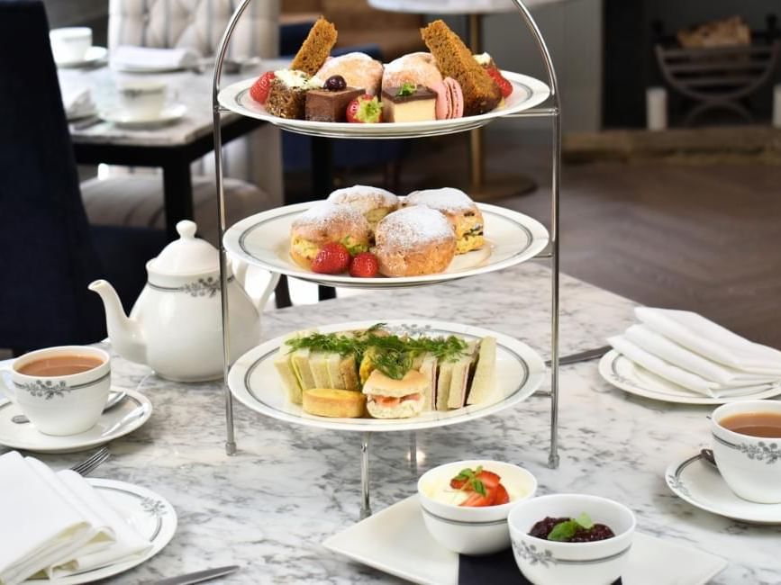 Luxury afternoon tea close up of cakes, sandwiches and tea at Villiers Hotel in Buckingham