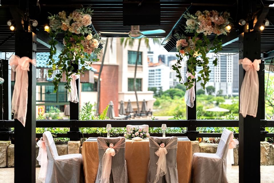 Outdoor wedding set-up with flower decor at Paradox Singapore