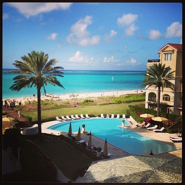 Sunbeds by the pool with sea view at The Somerset on Grace Bay
