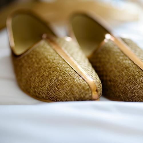 Grooms shoes removed as the saptapadi Hindu wedding ritual is taking place