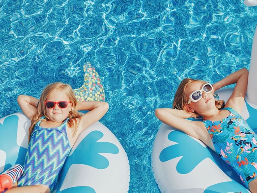 Girls relaxing on pool rings at Lake Buena Vista Resort Village & Spa