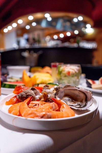 Seafood platter with prawns, oysters, and shellfish at Restaurant, Bar & Terrace Le W, an elite Restaurant in Paris