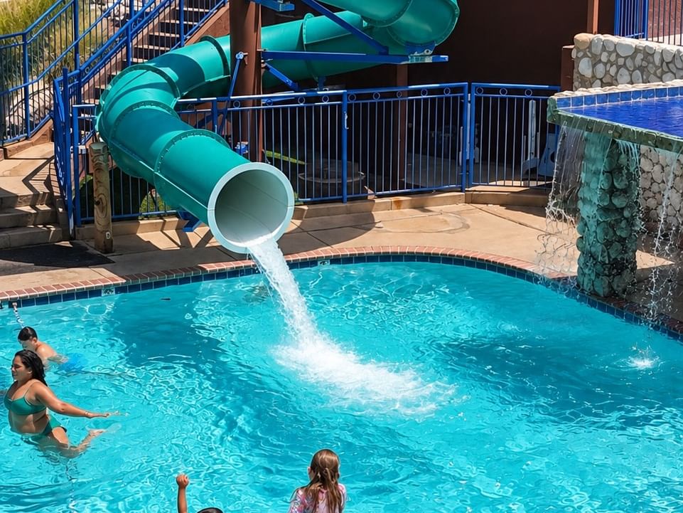Kids jumping into pool