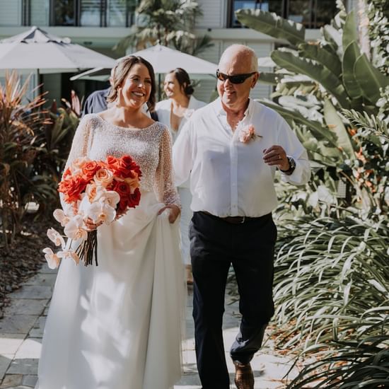 Wedding couple walking at Pullman Palm Cove Sea Temple Resort