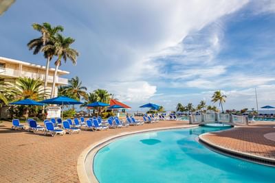 Outdoor pool with sunbeds at Holiday Inn Montego Bay