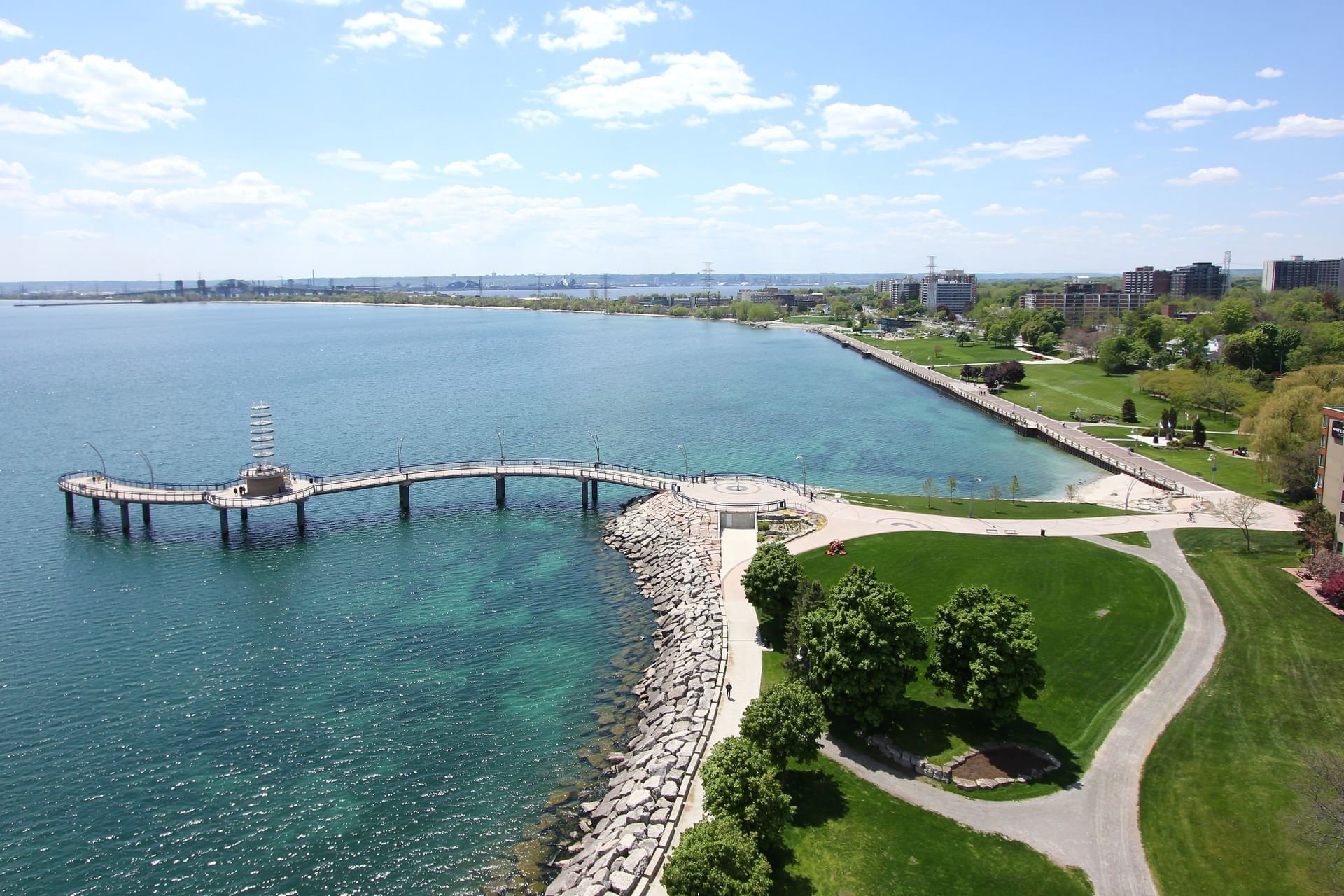 Aerial view of sea, jetty & trees near Waterfront Hotel