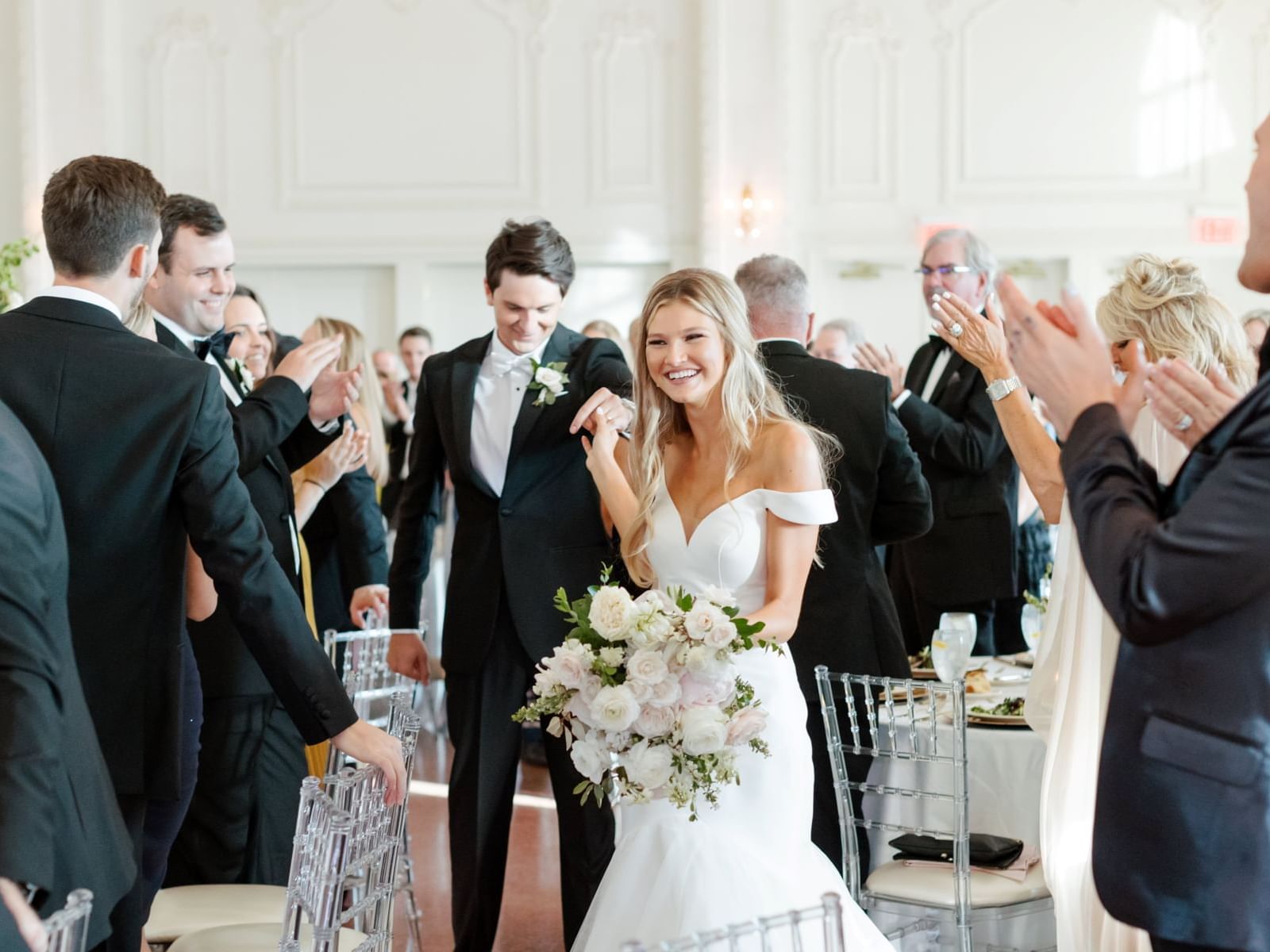 Wedded couple entering their reception at The Mayo Hotel