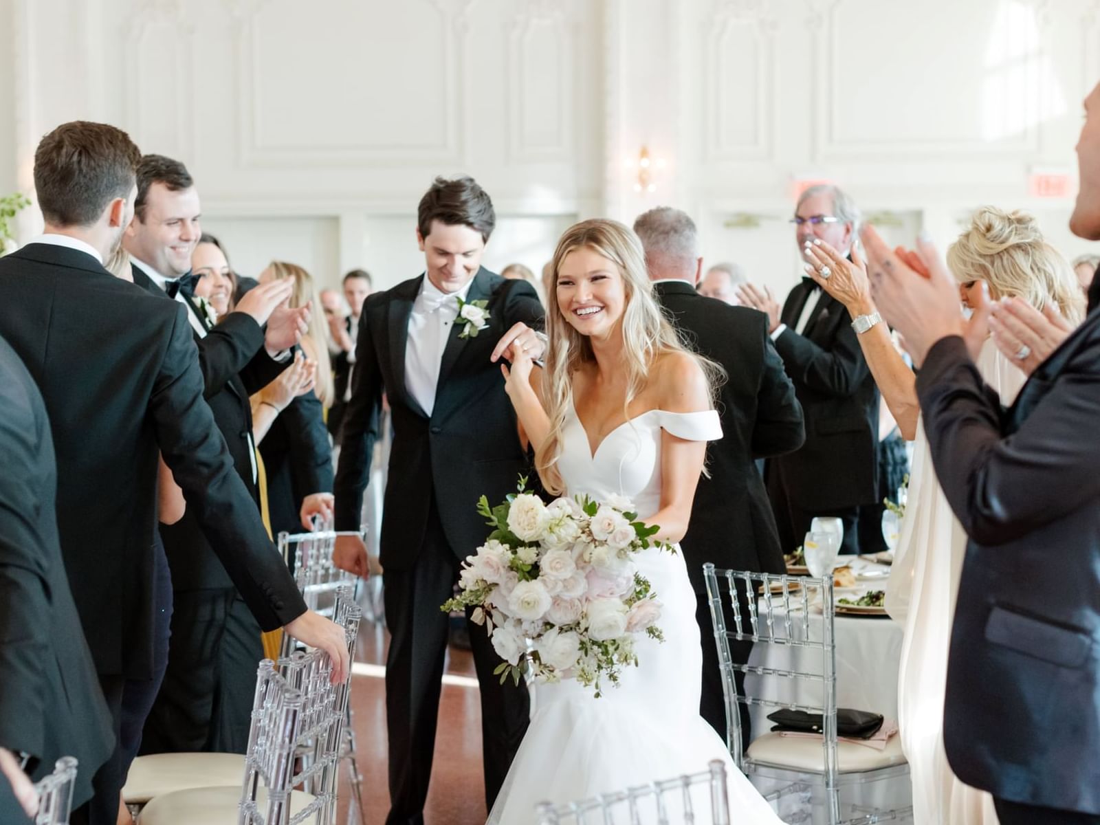 Wedded couple entering their reception at The Mayo Hotel