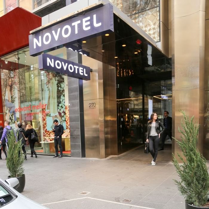 Close up on entrance sign of Novotel Melbourne on Collins