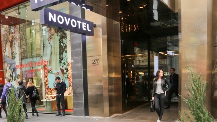 Close up on entrance sign of Novotel Melbourne on Collins