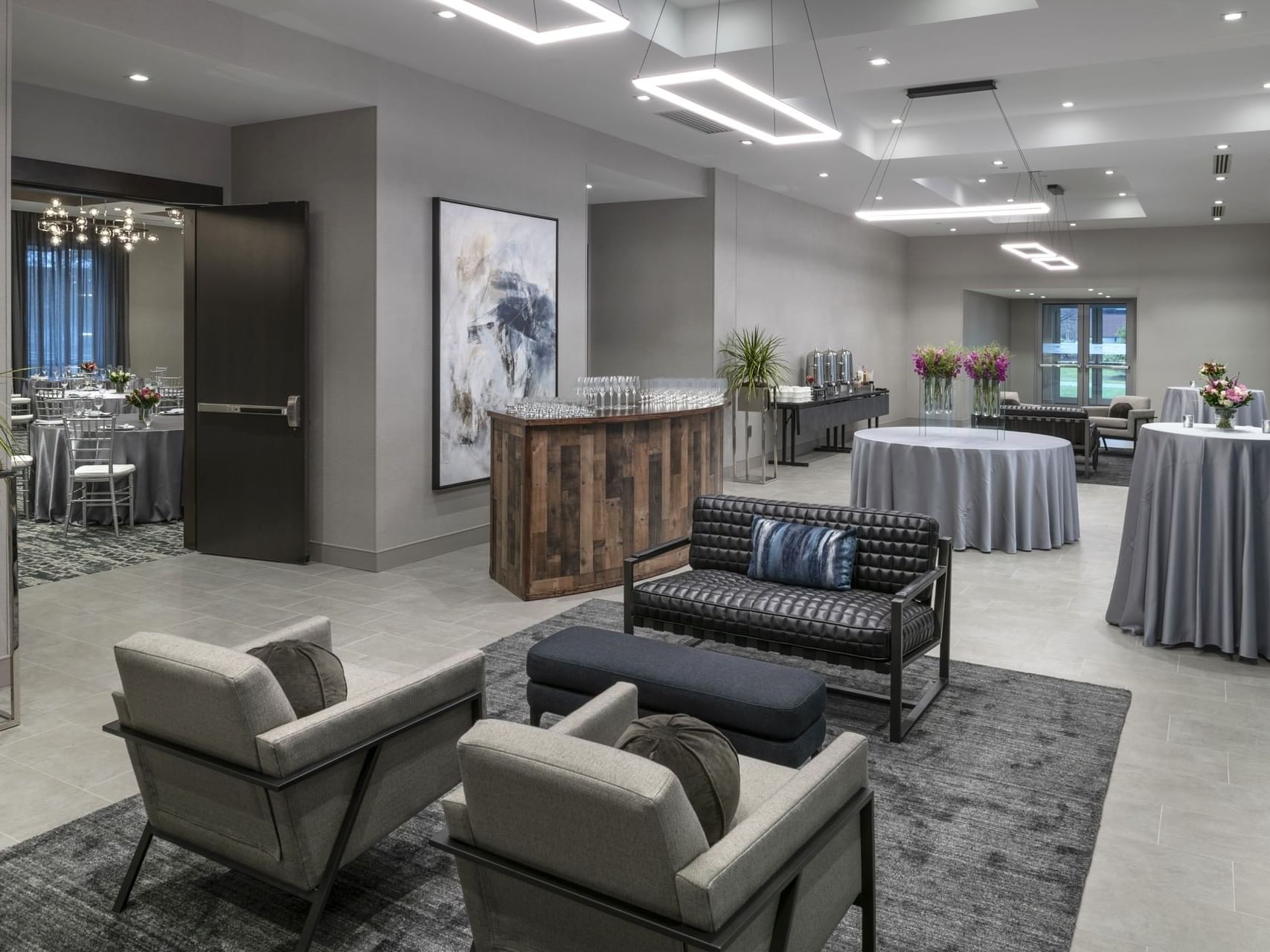 tables, chairs, and couches in a meeting space