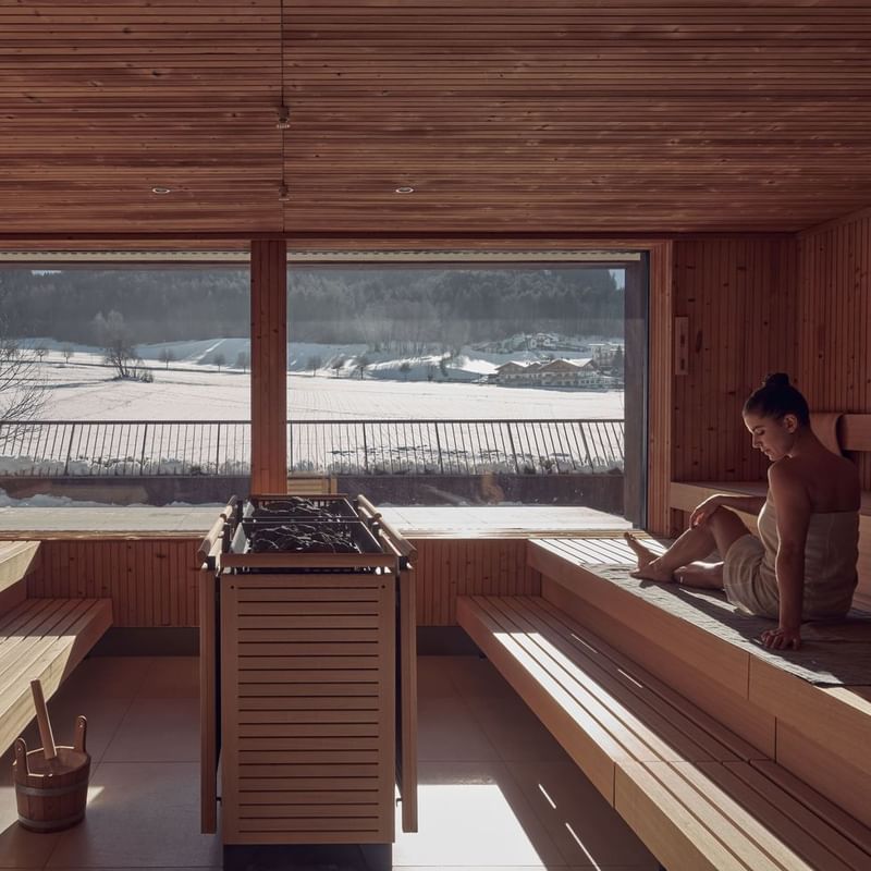 Lady relaxing in Finnish Sauna