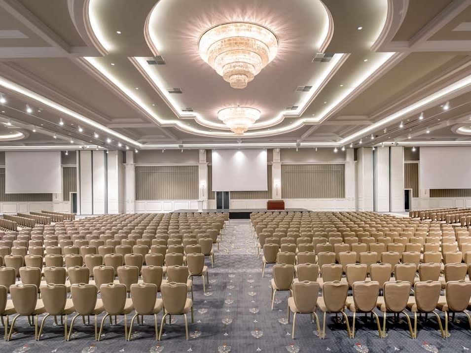 Theatre set-up with projector screens in Pacific Main Saloon at Titanic Deluxe Golf Belek