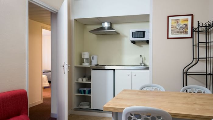 A kitchenette & Dining area in a hotel room at Hotel Cartier