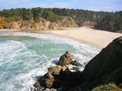 View of sandy beach from the coast at The Heritage House Resort