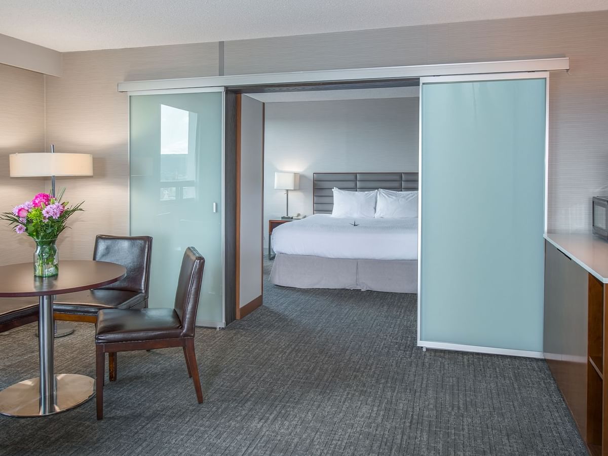 Spacious  suite with king bed and a living area with TV and couch