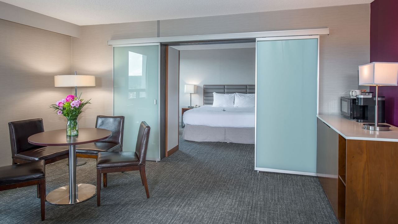 Spacious  suite with king bed and a living area with TV and couch
