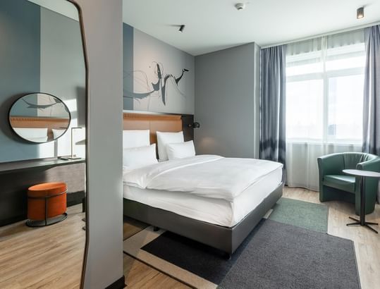 Comfy bed with a headboard in Classic Room at Titanic Comfort Kurfürstendamm