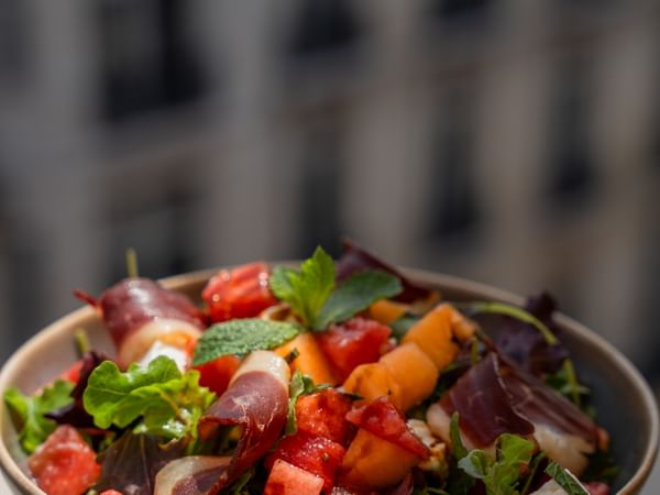 Summer salad with feta, melon and smoked duck breast 