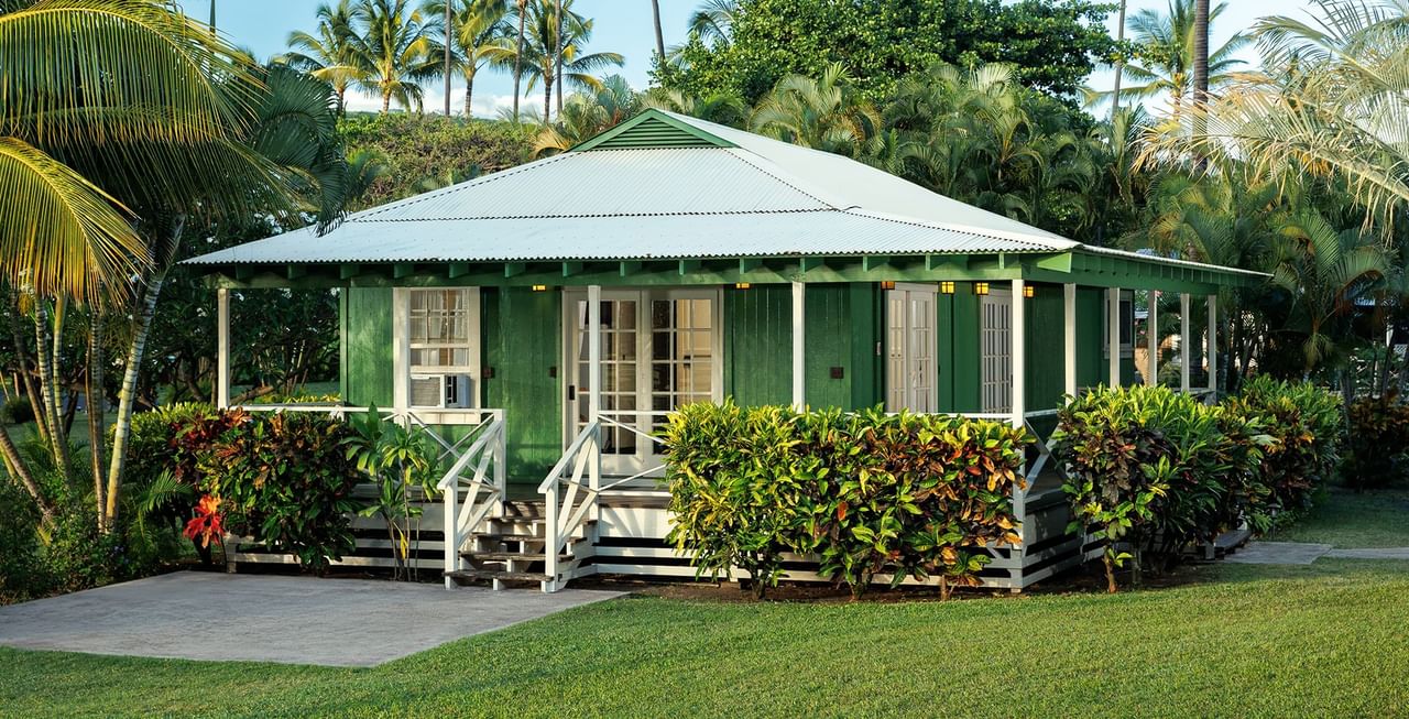 Green cottage and trees