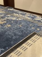 Accessible Room King with blue patterned carpet and tiled threshold at Warwick Hotel & Spa - Jeddah