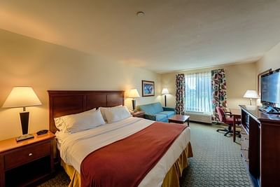 Kings bed in Standard King Room at Triple Play Resort Hotel