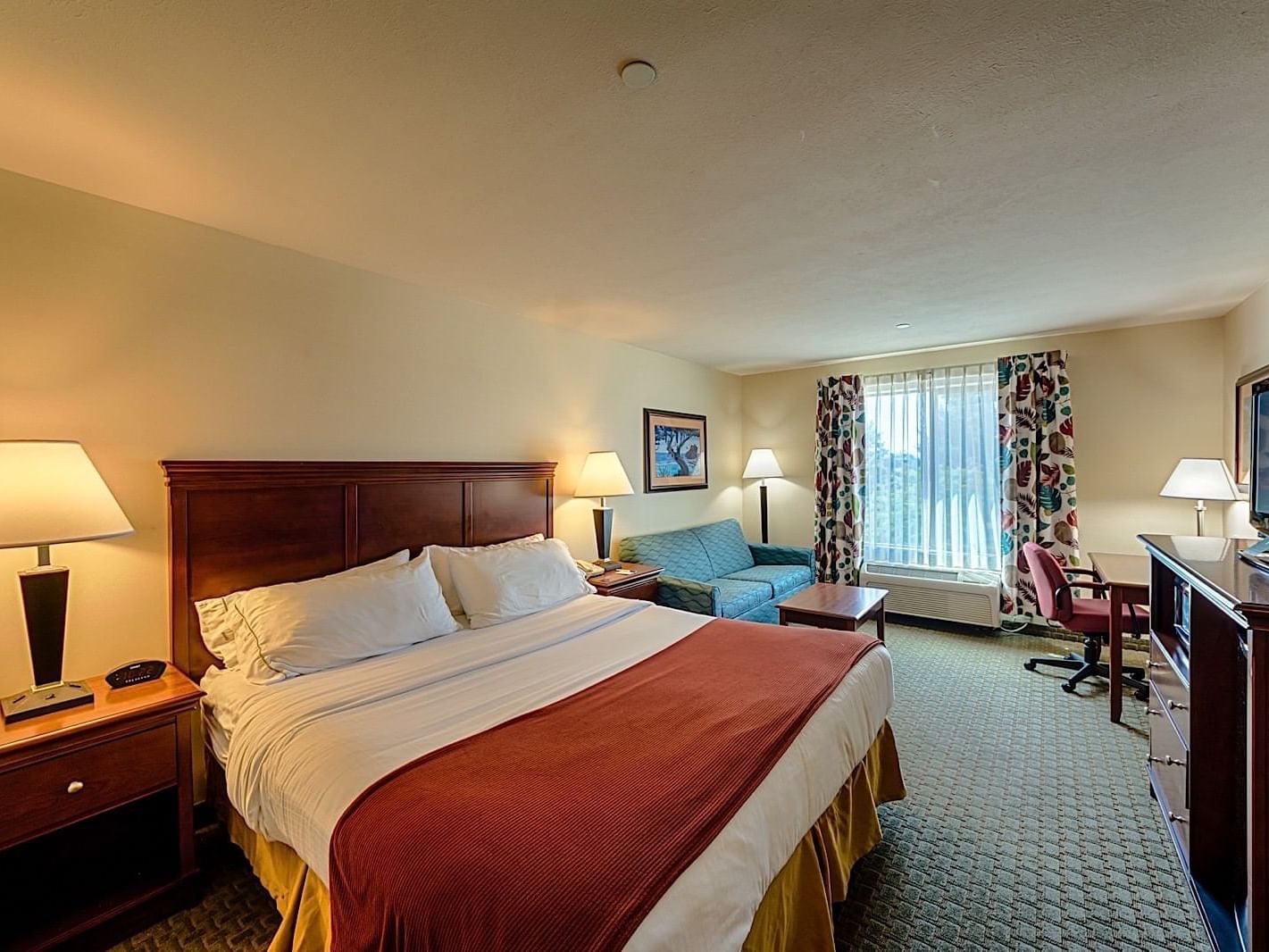 Kings bed in Standard King Room at Triple Play Resort Hotel