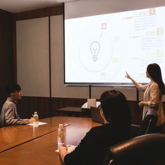 A girl presenting in a meeting room at Amara Sanctuary Resort