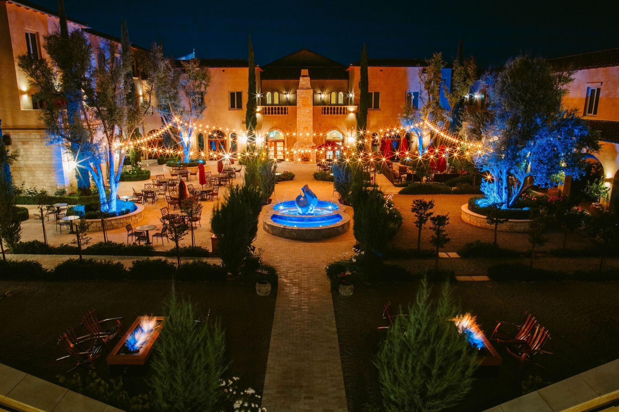 Piazza Magica Courtyard at night with bistro lighting