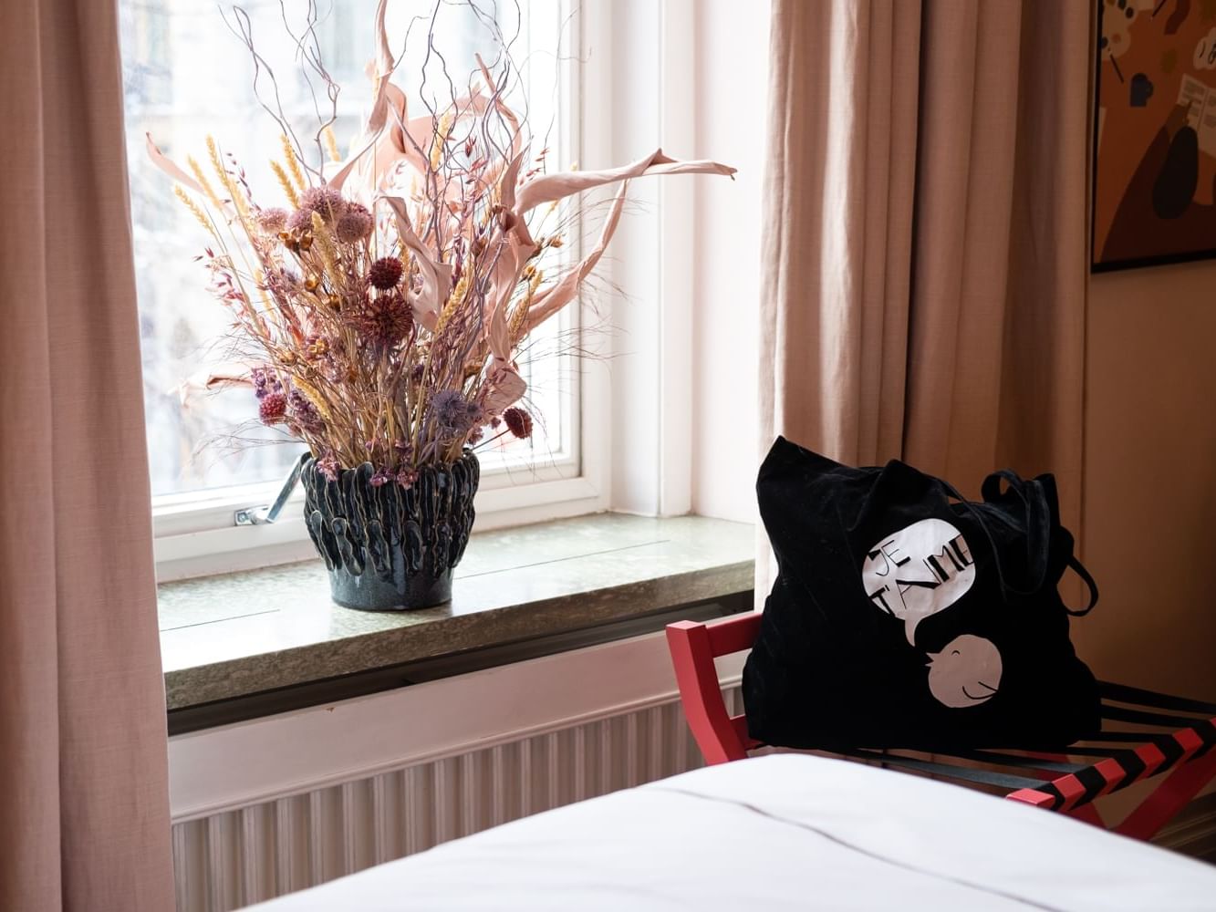Close-up on a flower vase by the window at The Sparrow Hotel